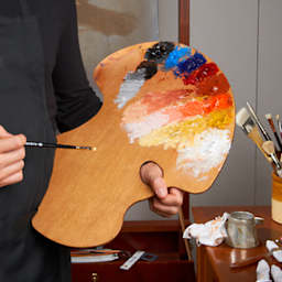 Painter holding Expressionist Confidant style Palette with Paint