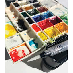 The classic Portable Painter Watercolor Palette with the split Expansion Pans for a total of 18 pans.