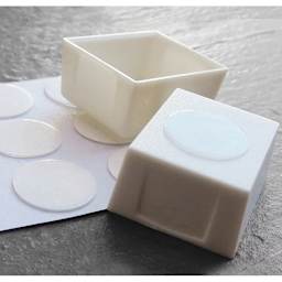 Half pan with adhesive dot to help keep it in place.