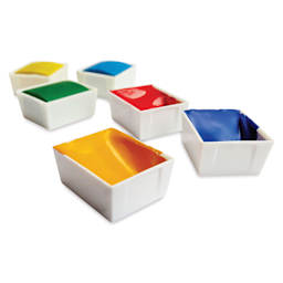 Portable Painter Watercolor Palette Half Pans filled with paint and removed from a palette.