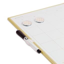 Gold Frame Dry Erase Boards - Angled view of Calendar Board with marker and magnets