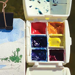 Portable Painter Watercolor Palette Pans filled with watercolor.