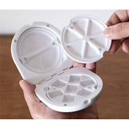 Etchr Travel Pocket Palette, open to show mixing wells and compartment for 7 half-pans