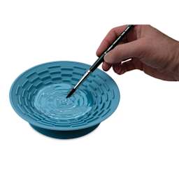 Top view of Silver Essentials Brush Cleaning Silicone Bowl while a brush is being washed.