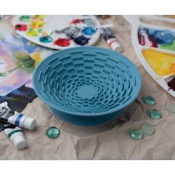 Silver Essentials Brush Cleaning Silicone Bowl on a studio table.