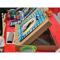 Side view of Toss Art Locker Portable Easel.