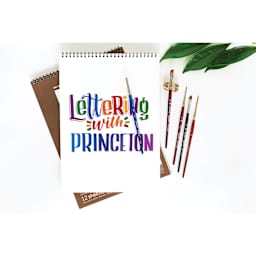 Princeton Brush Lettering Set (brushes being used to create colorful lettering on a paper pad)