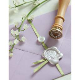 Manuscript Wax Sealing Kits - Example of ribboned envelope sealed with silver wax