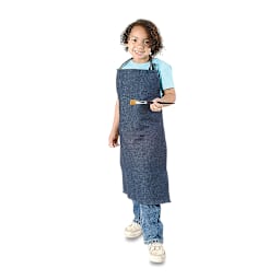 Children's Denim Apron - Child wearing apron and holding paintbrush shown