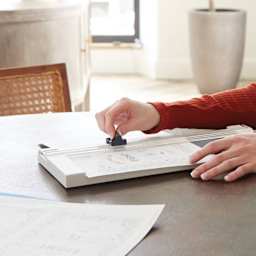 Swingline ClassicCut Fixed Blade Trimmer being used