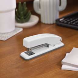 Swingline Cub Compact Metal Stapler - Arctic White sitting on table