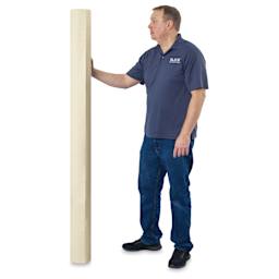 Blick Medium-Weight Unprimed Cotton Canvas by the Yard - 64-1/2" x 1 yard, man standing next to roll