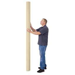 Blick Unprimed Cotton Canvas - Medium Weight, Medium-Smooth Texture, 96" x 25 yds, man standing next to canvas