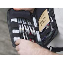 Etchr Field Case close-up of inside compartmentments and elastic loops for storing supplies. (Supplies not included.)