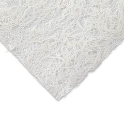 Black Ink Thai Kozo Paper - Closeup of corner of Natural White Kozo to show texture and color
