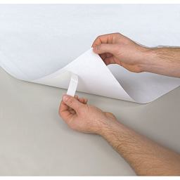 Present-It Easel Pad - Hands removing self-sticking tape from back of sheet
