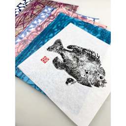 Yasutomo Sumi Painting Paper Roll - 9-1/2" x 20 ft, Hosho, 63 gsm, gyotaku fish print and colorful patterns on cut sections of paper.