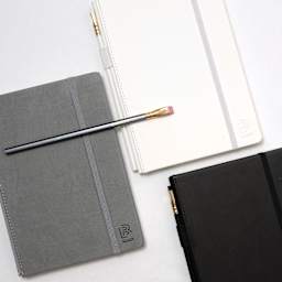 Blackwing Slate Notebooks, gray, white, and black notebooks closed