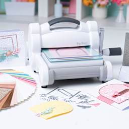 Sizzix Big Shot Machine Starter Kit in use on table