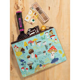 Blue Q Zipper Pencil Pouch - Cute Lil' Mushrooms, 9-1/2" x 7-1/4", on desk