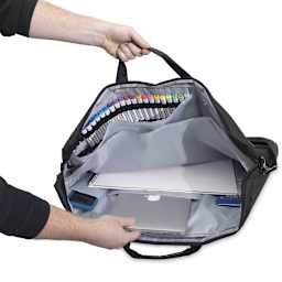 Prat Digital and Art Portfolio - Artist holding large portfolio open