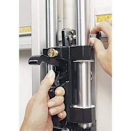 Fletcher 3000 Multi-Material Wall-Mount Cutter - Hands shown adjusting mounted Cutter