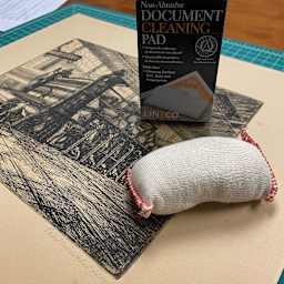 Lineco Document Cleaning Pad, in use on top of print (not included)