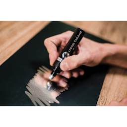 Molotow Liquid Chrome Marker - 5 mm, Bold marker in hand reflected on drawing