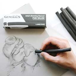 General's Jumbo Willow Charcoal - Pkg of 6 (shown in use sketching a portrait)