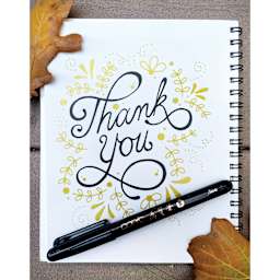 Copic Gasenfude Brush Tip Pen on sketchbook with hand lettering.