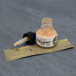 Higgins Acrylic Ink - Gold, 1 oz bottle with dropper and swatch over black paper