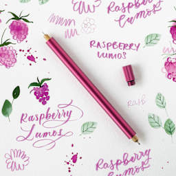 Tom's Studio Lumos Pro Refillable Dual Tip Pen Set - Raspberry, pen laid out