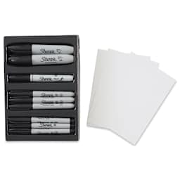 Sharpie Be Bold Lettering Kit. Inside of package shown. Includes eight markers (two Black Ultra Fine Tip, three Black Fine Tip, two Black Chisel Tip, and one Black Brush), an instruction book, and tracing paper.
