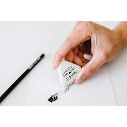 General's Tri-Tip Eraser - Artist's hand using eraser on paper