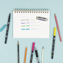 Tombow Mono Colored Pencil Eraser, in use next to pencil, colored pencil, marker, and pen