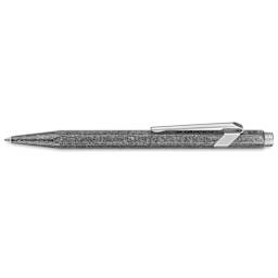 Caran d'Ache 849 Premium Ballpoint Pen - Original, side view revealing logo under pen clip