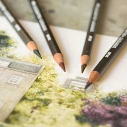 Derwent Graphitint Pencils with a landscape drawing