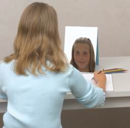Self Portrait Mirror - Child using mirror to sketch a self portrait