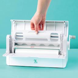 Xyron Creative Station Permanent Adhesive Refill Cartridge - 9" x 40' seated inside laminator