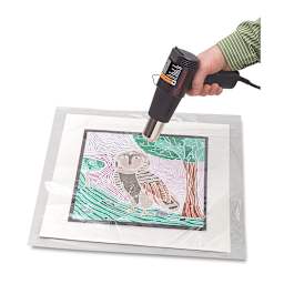 Mountex Shrink Film being shrunk with heat gun.