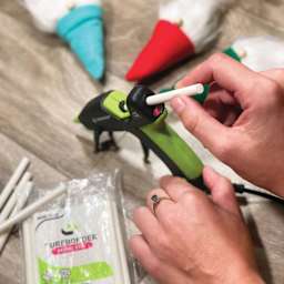 Surebonder Mini Fabric Stik All-Temp Hot Glue Sticks - 4" x 5/16", Pkg of 18 (Glue stick loaded into glue gun)