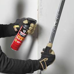 DAP Weldwood Original Contact Cement Spray Adhesive being applied to metal