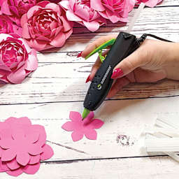 Surebonder Specialty Series Detail Tip Dual Temp Mini Hot Glue Pen, applying glue with hot glue pen held.