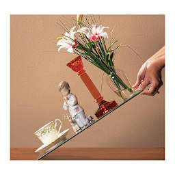 Collector’s Hold! Museum Putty - Hand tilting shelf 45 degrees with breakables all safely secured