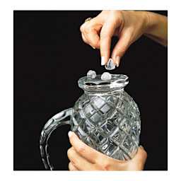 Clear Museum Gel - hands attaching gel balls to bottom of glass pitcher