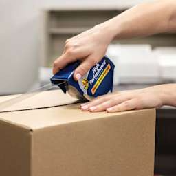 Duck HP260 High Performance Premium Packing Tape - 1.88" x 60 yds, with Dispenser - in use