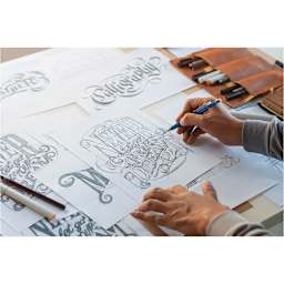 Blick Essentials Mechanical Pencil - Blue Black, 0.7 mm (hand using the pencil for lettering)