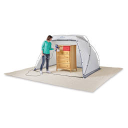 HomeRight Spray Shelters - Woman with Spray gun spray painting a dresser in Large Shelter