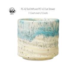 Cone 6. PG-42 Teal Drift over PCF-63 Sun Shower. 1 Coat over 2 Coats.