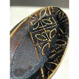 Cosmic Oilspot Amaco Potter's Choice Glaze applied to a plate.